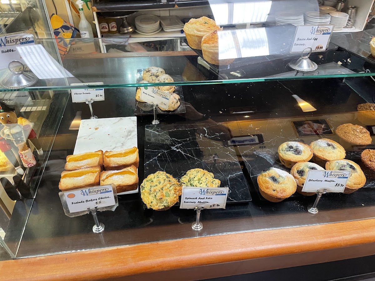 Fresh scones, friands and muffins in the bakery cabinet
